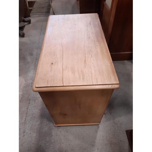 2186 - A stripped and waxed pine chest of two long and two short drawers