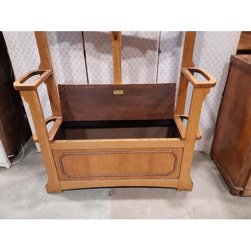 2190 - A simple oak hallstand, the central mirror panel over a box seat