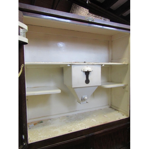 2194 - A vintage Hygena oak kitchen cabinet of full height enclosed by a series of drawers and cupboards an... 