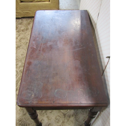 2201 - A Victorian mahogany side table fitted with two frieze drawers on four turned supports