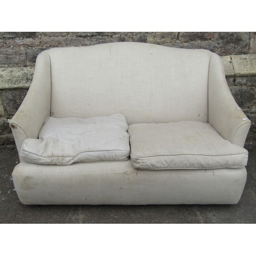 2205 - A small cottage two seat sofa upholstered in linen - for reupholstery, 130 cm wide