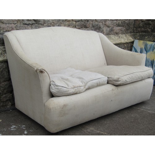 2205 - A small cottage two seat sofa upholstered in linen - for reupholstery, 130 cm wide