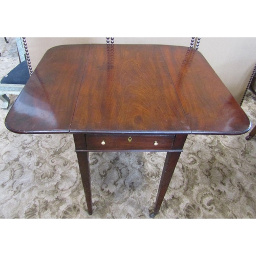 2207 - An early 19th century mahogany Pembroke table fitted with the usual one real and one dummy frieze dr... 