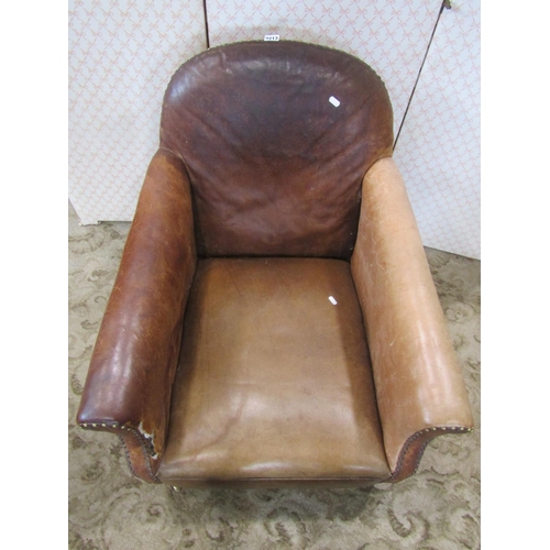 2213 - An Edwardian drawing room chair upholstered in mid tan coloured brown leather