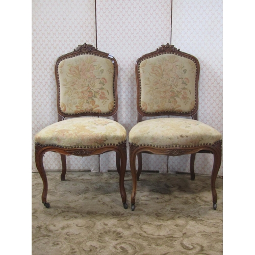 2214 - A French salon chair with carved walnut showwood frame and two matching side chairs, all with Audubo... 