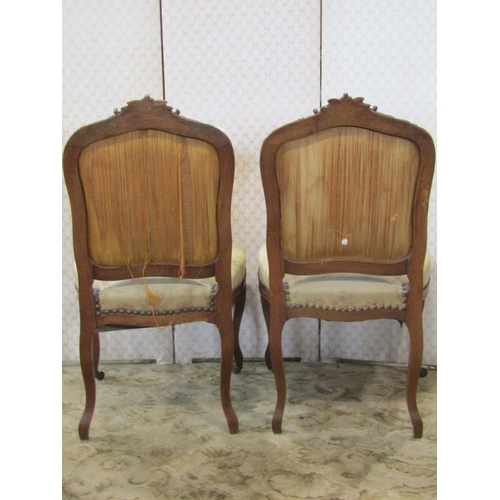 2214 - A French salon chair with carved walnut showwood frame and two matching side chairs, all with Audubo... 