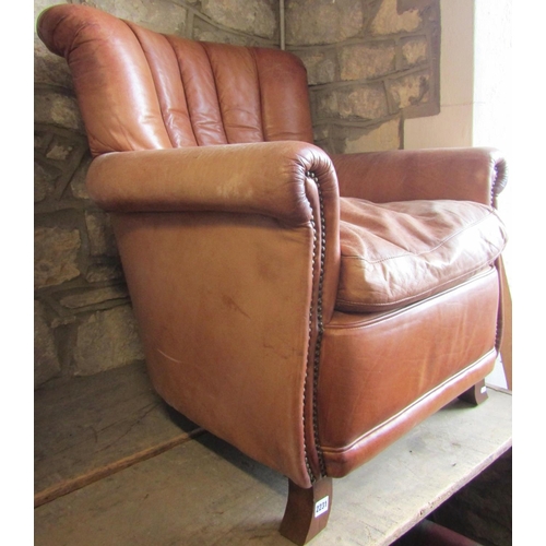 2231 - Contemporary drawing room chair upholstered in mid tan coloured leather upholstery, on swept support... 