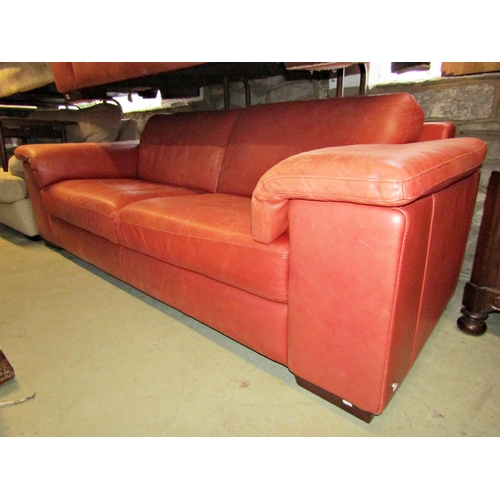 2236 - A Natuzzi Italia three seat sofa with stitched faded red leather upholstered finish with loose cushi... 