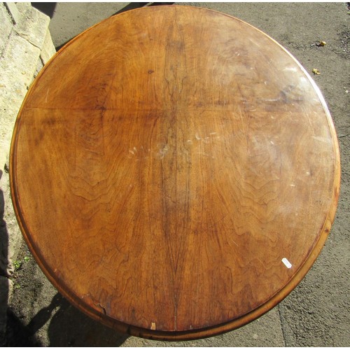 2238 - A Victorian walnut loo table, the oval top raised on a platform base with turned column supports and... 