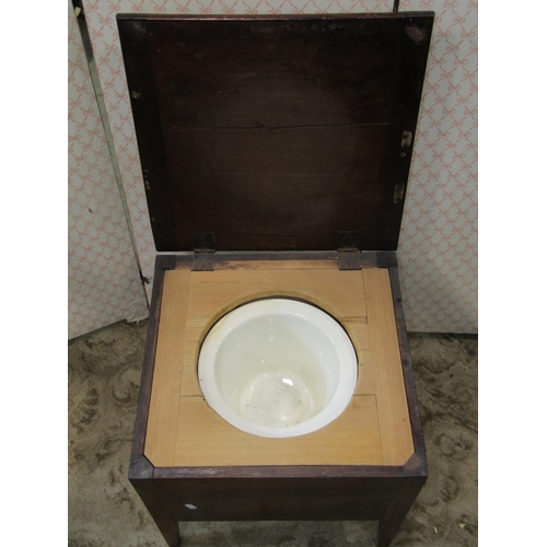 2242 - A Georgian mahogany box commode with rising lid and original fitted interior on swept supports