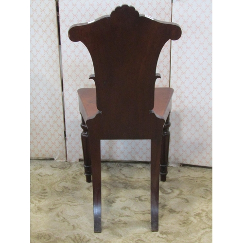 2246 - Regency mahogany hall chair, the shaped back with acanthus and other detail, raised on turned and ta... 