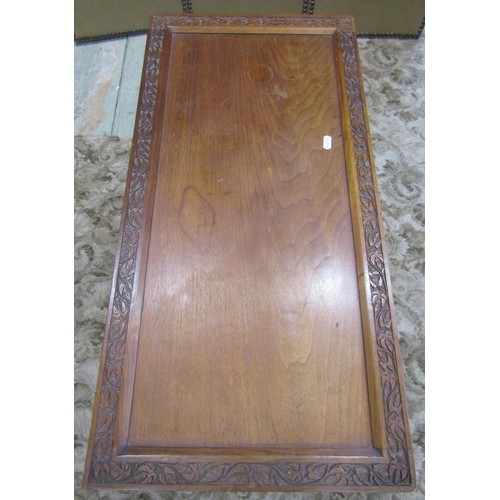 2265 - An Indian hardwood card table of rectangular form with foldover top, raised on a slender hexagonal c... 