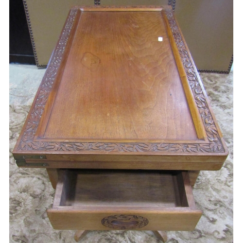 2265 - An Indian hardwood card table of rectangular form with foldover top, raised on a slender hexagonal c... 