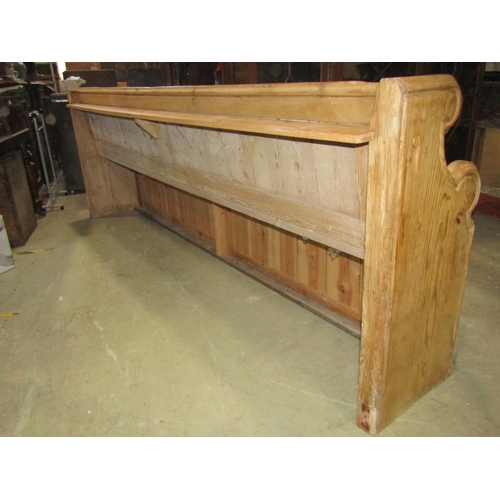 2289 - Stripped and waxed pine pew with shaped ends, 250cm long