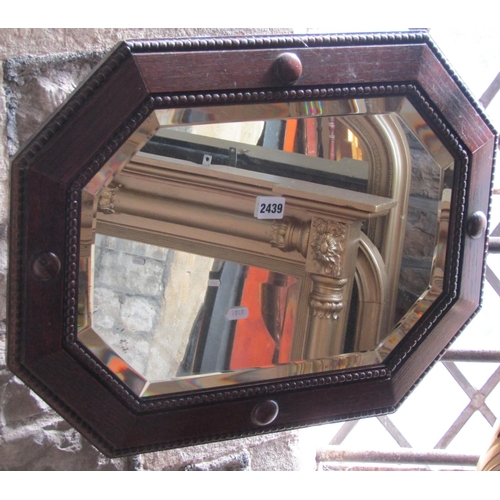 2306 - Three 1920s oak framed wall mirrors of octagonal design (3)