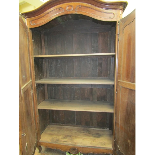 2339 - 18th century provincial French walnut armoire enclosed by a pair of panelled doors with steel hinges... 