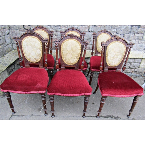 2341 - A set of six Victorian walnut dining chairs with turned supports and shaped backs with upholstered s... 