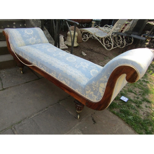 2342 - Regency mahogany chaise lounge with scrolled ends, carved showwood frame raised on fluted supports