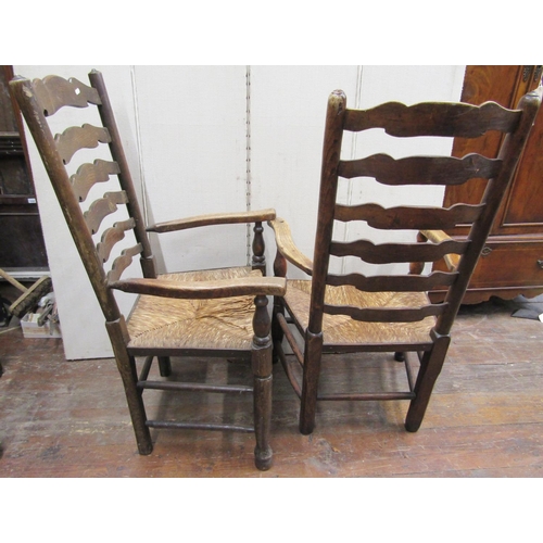 2347 - Four (3 arm, 1 single) ashwood ladderback dining chairs with rush seat and turned supports