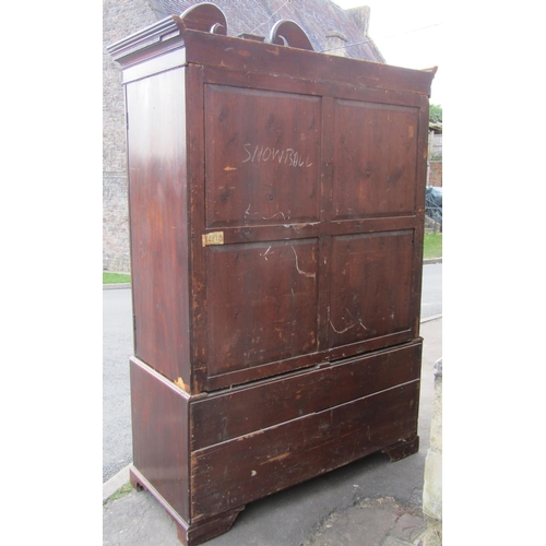 2356 - A George III mahogany linen press with broken swan neck architectural pediment, over a pair of recta... 