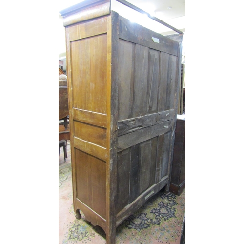 2359 - 18th century fruitwood armoire enclosed by two panelled doors with brass fittings, the interior encl... 