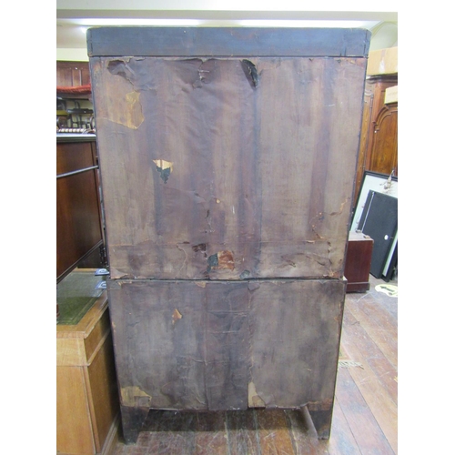 2368 - A small Georgian mahogany chest on chest, six long and two short drawers beneath an arched outline a... 