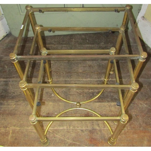 2371 - A set of three graduated brass framed occasional tables, cylindrical tapering supports, the smallest... 