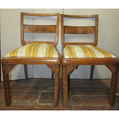 2379 - A set of six art deco walnut and figured walnut dining chairs with bar backs and upholstered seats