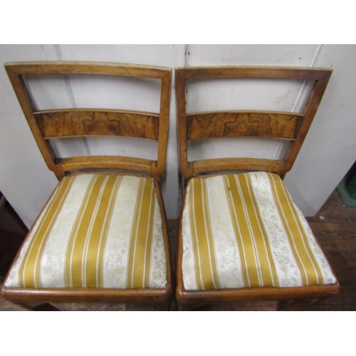 2379 - A set of six art deco walnut and figured walnut dining chairs with bar backs and upholstered seats