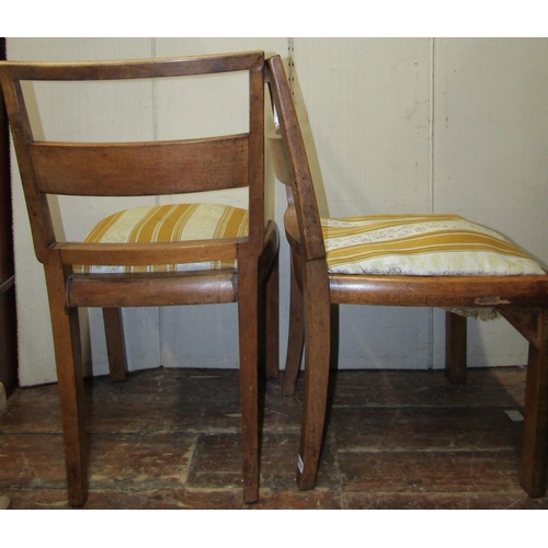 2379 - A set of six art deco walnut and figured walnut dining chairs with bar backs and upholstered seats