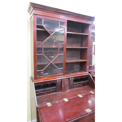 2380 - A Georgian mahogany bureau bookcase of three long and three short drawers, the fall flap enclosing a... 