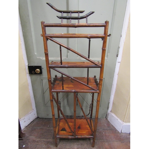 2384 - A Bamboo side table with four tiers, gilded highlights and geometric marquetry panels, 45cm high