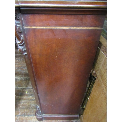 2385 - A Victorian mahogany breakfront bookcase enclosed by three arched and glazed panelled doors, with fu... 