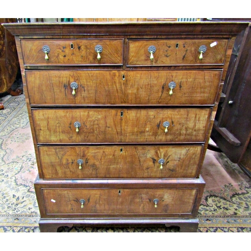 2387 - A Georgian walnut chest on stand, the chest of three long and two short graduated drawers, the stand... 