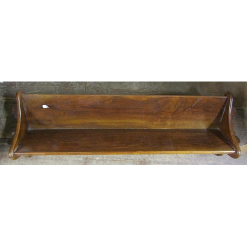 2388 - A walnut book trough with pegged frame, 85cm long