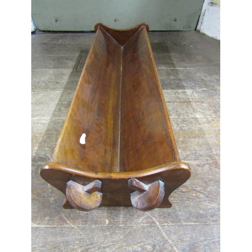 2388 - A walnut book trough with pegged frame, 85cm long