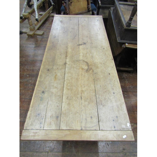 2392 - A French provincial farmhouse table mainly in fruitwood, the plank top with cleated ends, rasied on ... 