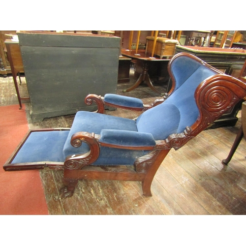 2397 - A late Regency period mahogany framed reclining armchair, raised on lions paw feet with scrolled aca... 