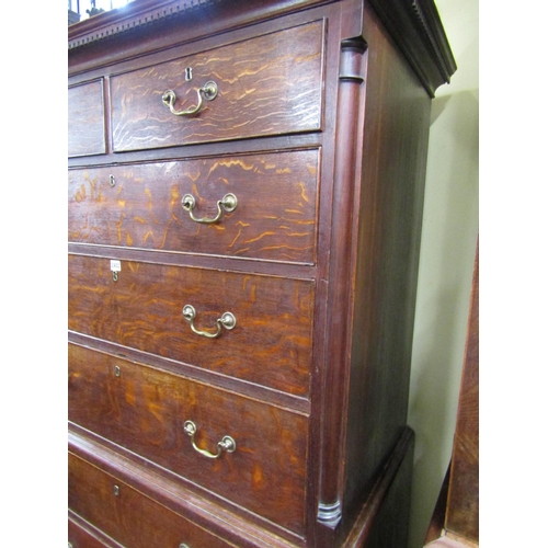 2402 - A Georgian oak chest on chest of six long and two short drawers, the upper section with canted corne... 