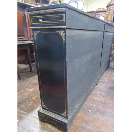 2404 - A pair of Victorian brass and ebonised inlaid pier cabinets, each enclosed by a pair of panelled gla... 