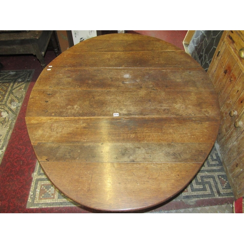 2406 - A Georgian oak gateleg dining table raised on eight turned supports, 125cm long