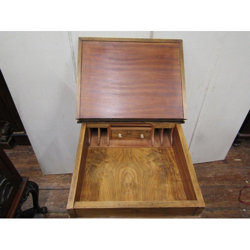 2408 - A Victorian style walnut davenport fitted with an arrangement of drawers, the fall flap enclosing a ... 