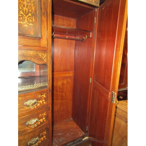 2410 - A late 19th century rosewood triple compactum wardrobe, the bow fronted centre fitted with an arrang... 