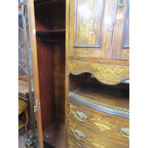 2410 - A late 19th century rosewood triple compactum wardrobe, the bow fronted centre fitted with an arrang... 