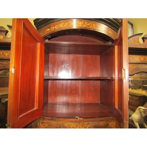 2410 - A late 19th century rosewood triple compactum wardrobe, the bow fronted centre fitted with an arrang... 