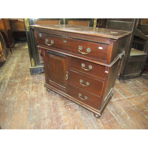 2421 - An Edwardian mahogany compactum writing desk by Simpson and Sons of Halifax and Blackburn, the foldo... 