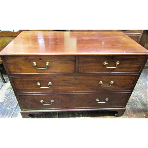 2422 - A Georgian mahogany chest of two long and two short drawers on bracket supports, 110cm wide