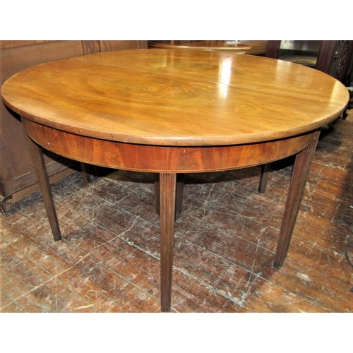 2424 - A Georgian mahogany D end sectional dining table with two additional leaves, raised upon square moul... 