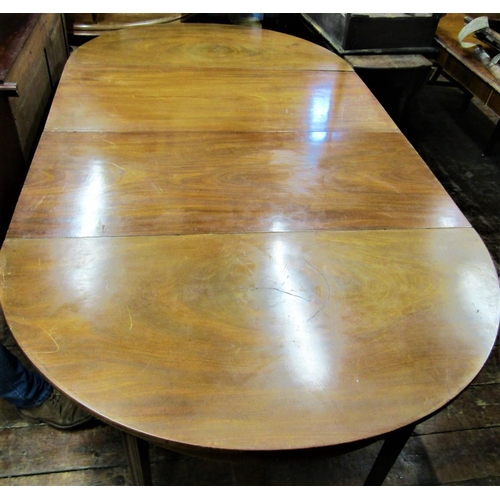 2424 - A Georgian mahogany D end sectional dining table with two additional leaves, raised upon square moul... 