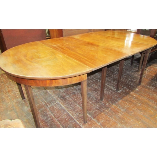 2424 - A Georgian mahogany D end sectional dining table with two additional leaves, raised upon square moul... 